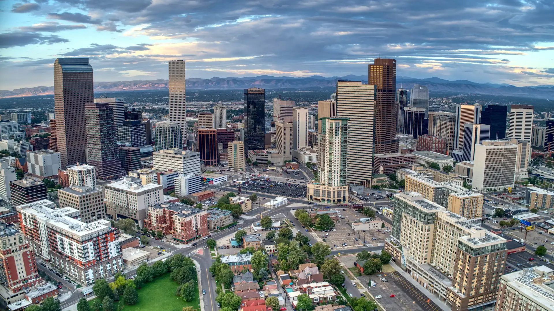 The downtown Denver skyline with the Rocky Mountains behind